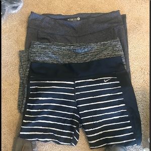 1 pair Nike capri, 1 pair old navy capri, 1 pair old navy long workout leggings